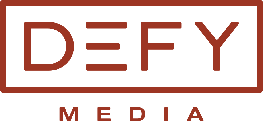 A green and red logo for def media.